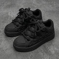 Suie, sneakers noires à semelle épaisse