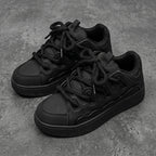Suie, sneakers noires à semelle épaisse