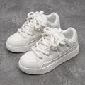 Suie, sneakers blanches à semelle épaisse